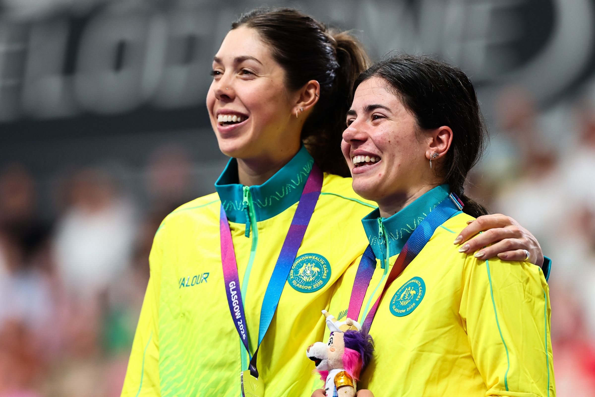 Alyssa Polites and Georgia Baker on the podium together of the women's elimination race in the Glasgow 2026 Commonwealth Games.
