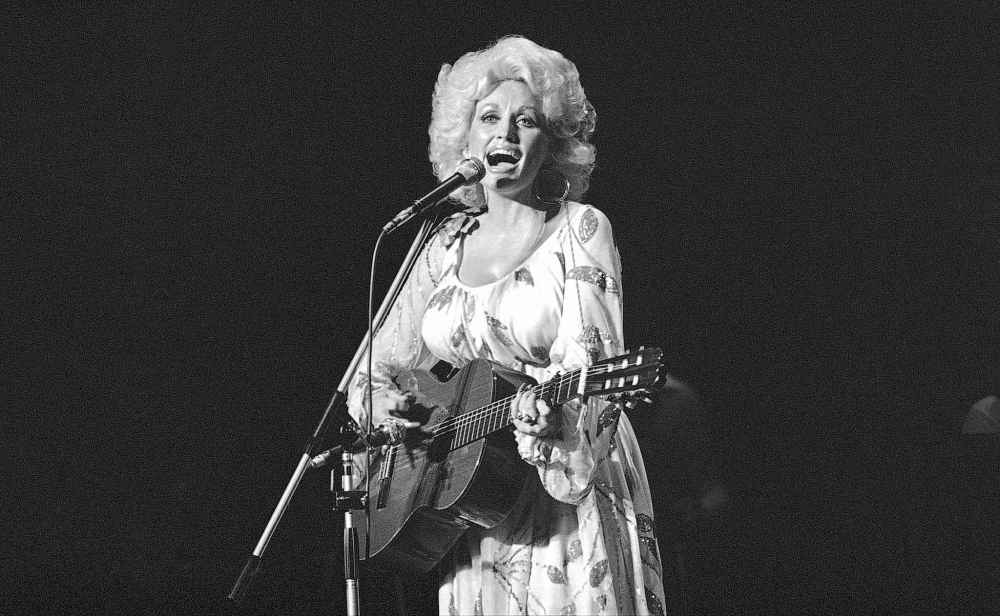 Dolly Parton performs in concert in Tokyo, July 30, 1979. (AP Photo/Tsugufumi Matsumoto, file)