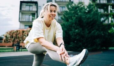 Woman setting up to do lateral leg raises outside