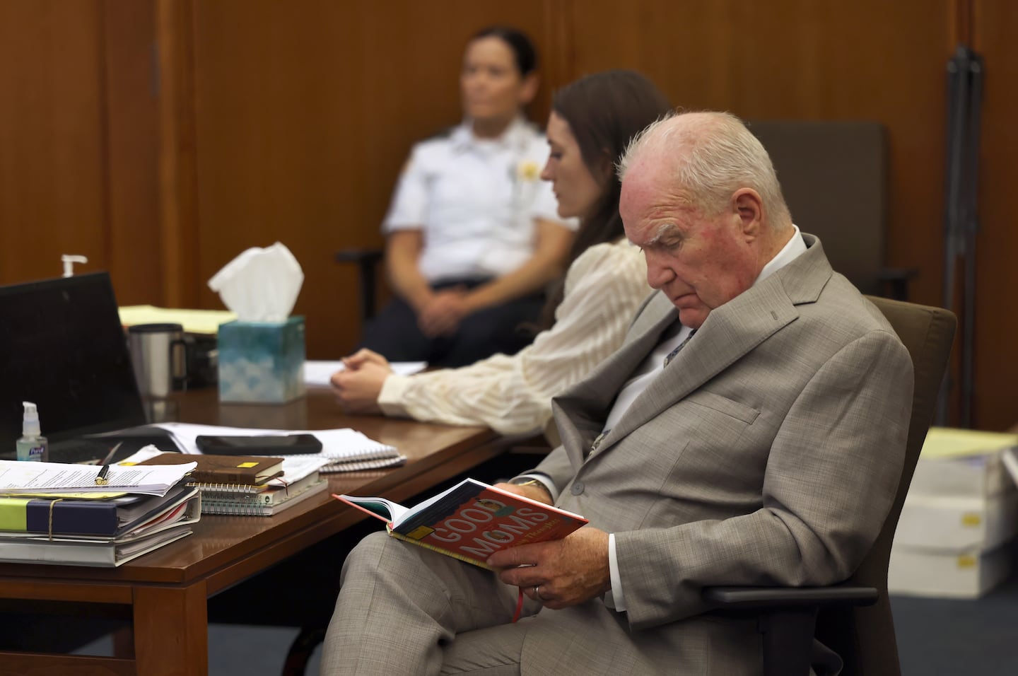 Lindsay Clancy's defense attorney Kevin Reddington looked over a book titled "Good Moms Have Scary Thoughts," marked as an exhibit during the trial at Plymouth Superior Court in Plymouth on Aug. 5.