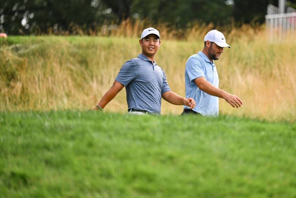 Scottie Scheffler and Tom Kim during the final round of the Travelers Championship at TPC River Highlands