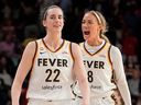 Caitlin Clark #22 of the Indiana Fever celebrates with Sophie Cunningham #8 after scoring the game-winning three pointer during the second half against the Washington Mystics at CareFirst Arena on June 08, 2026 in Washington, DC.