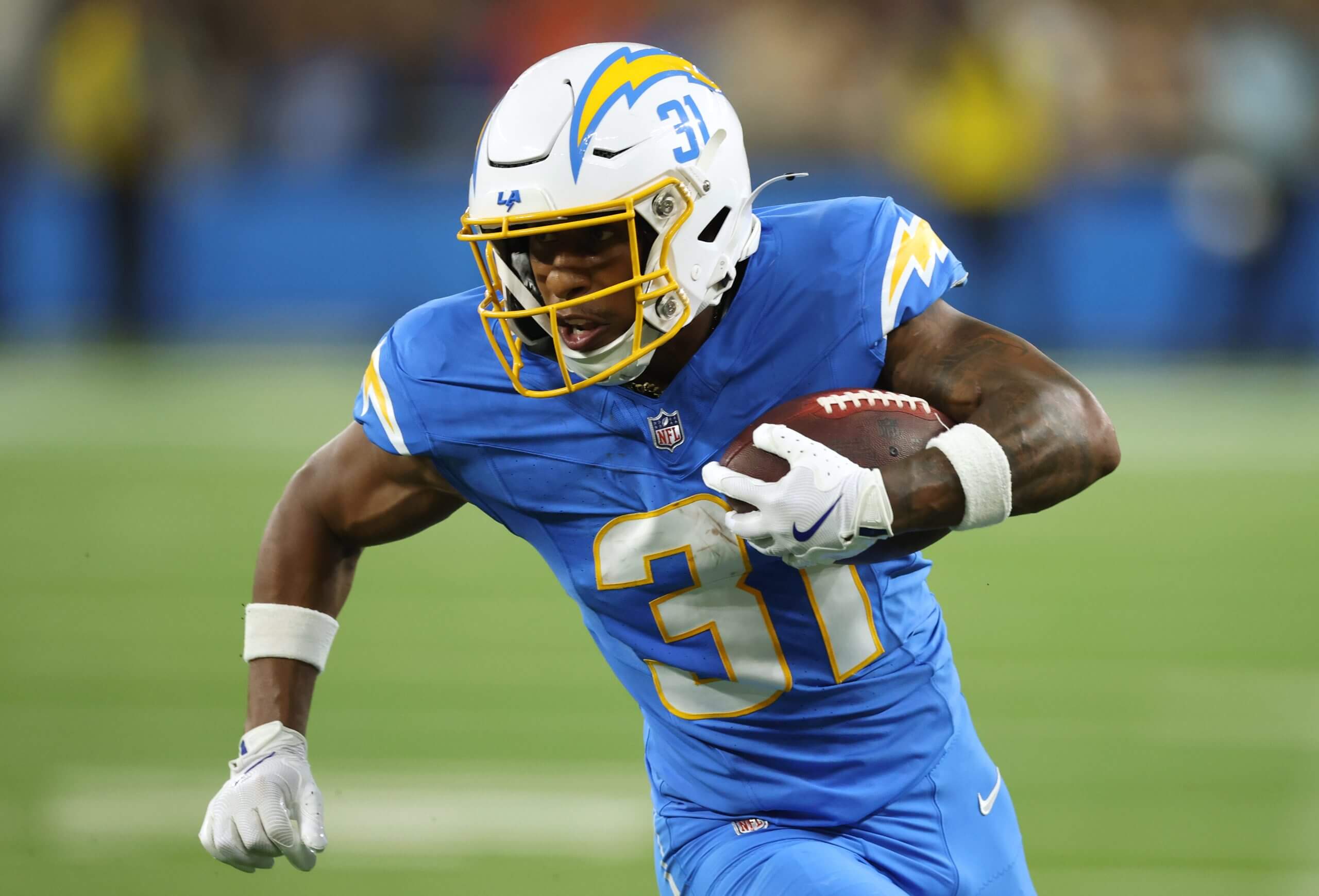 Greg Desrosiers Jr. #31 of the Los Angeles Chargers carries the ball during a preseason game between the Los Angeles Rams and the Los Angeles Chargers