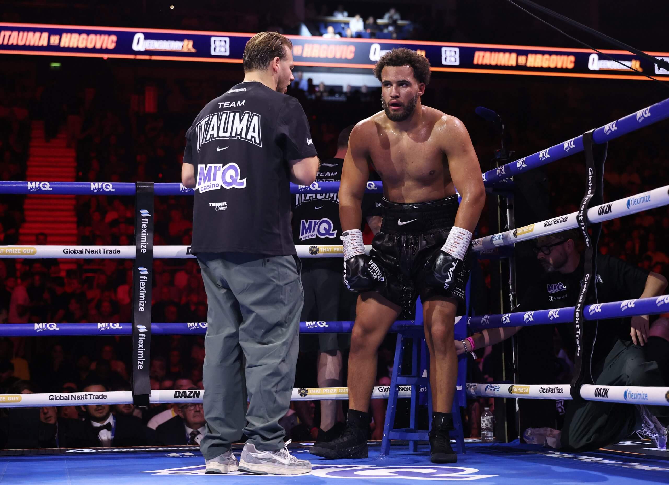 Moses Itauma contemplates his defeat beside trainer Ben Davison