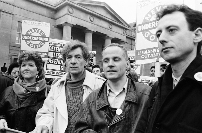 Clause 28 March Manchester Ian McKellen, Michael Cashman and Peter Tatchell on a demonstration against Clause 28 in 1988, outside an official building in Manchester.
