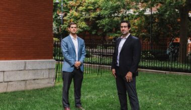 Amylyx co-founders Justin Klee, left, and Joshua Cohen outside of their offices in Cambridge, Mass., in 2020.