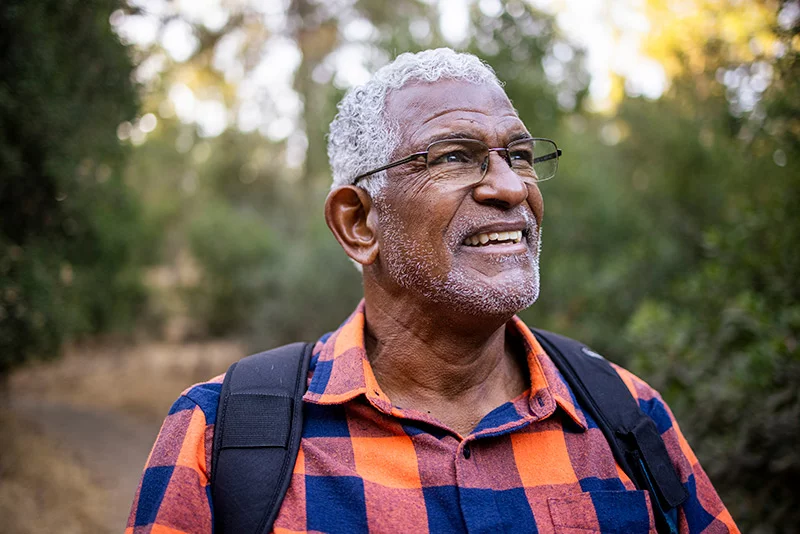 Older man out hiking. Advice on daily baby aspirin is complicated.