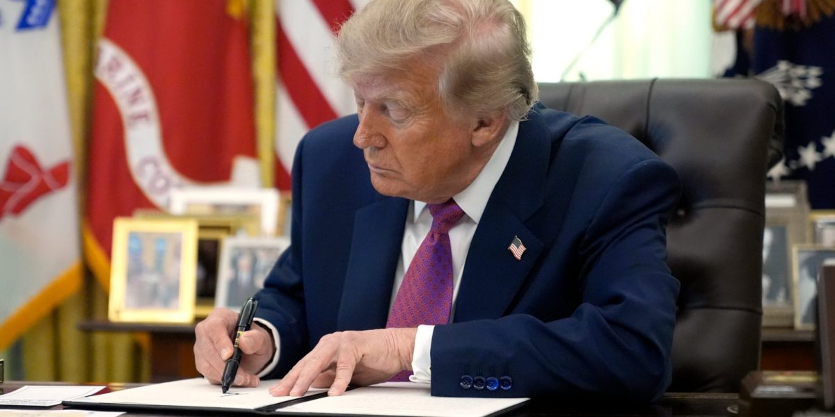President Donald Trump signs an executive order in the Oval Office of the White House, Thursday, Aug. 27, 2026, in Washington. (AP Photo/Manuel Balce Ceneta)