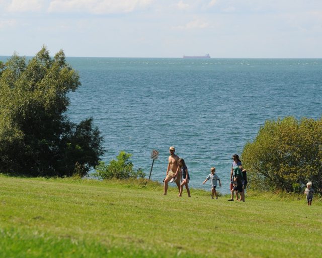 YOUNGSTOWN, NEW YORK - AUGUST 27: Visitors to Old Fort Niagara State Park relax on the shores of Lake Ontario August 27, 2026 in Youngstown, New York. U.S. President Donald Trump today signed an executive order renaming the smallest by surface area of the five Great Lakes, Lake America. (Photo by John Normile/Getty Images)