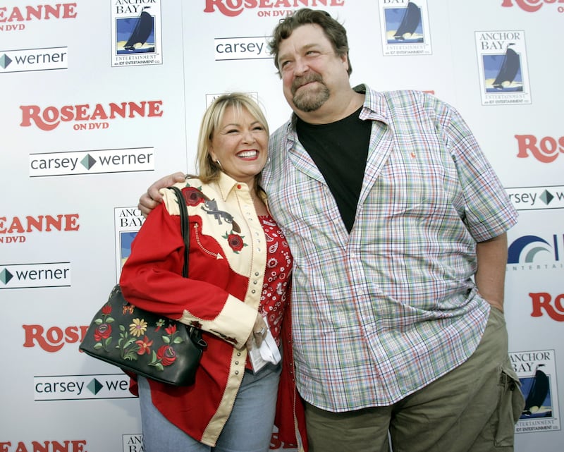 Cast members Roseanne Barr (L) and John Goodman arrive at the Roseanne TV series season one DVD release party in Hollywood July 18, 2005. The cast of the 1988 television series is reunited for the first time in nine years. REUTERS/Mario Anzuoni  MA/mk