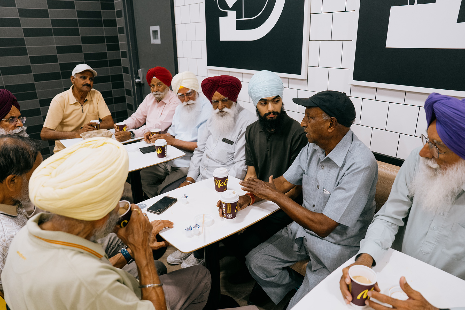 Following their weekly cleanup, Rajbalinder Ghatoura and local seniors meet for coffee at a McDonald’s. 