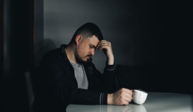 Sad man holding his head