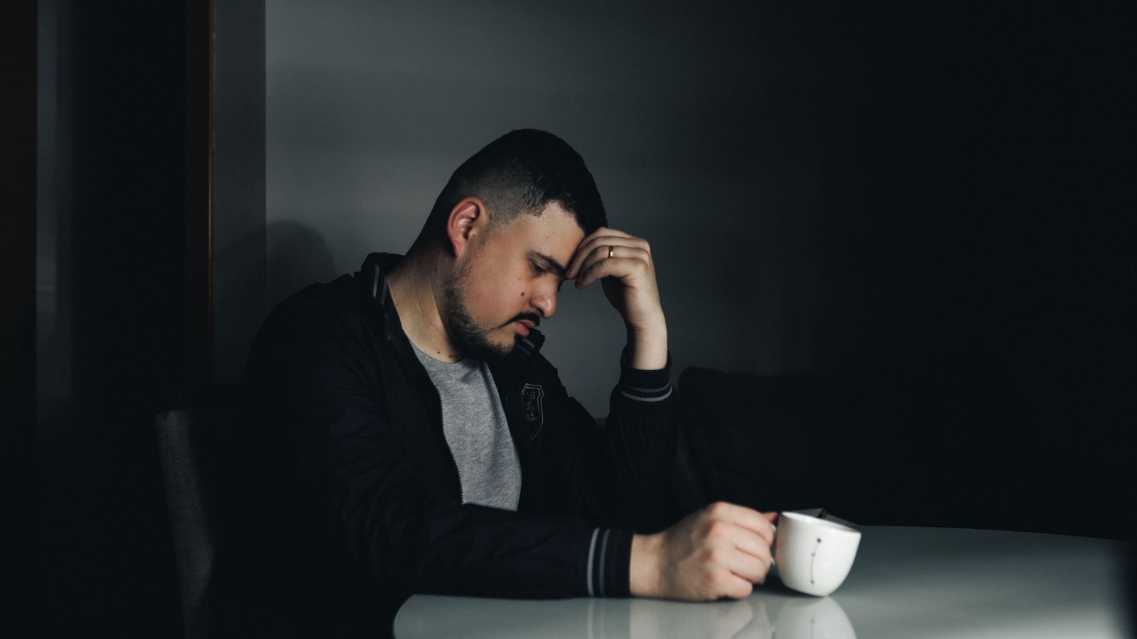 Sad man holding his head