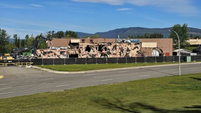Crews operate heavy machinery as work gets underway to demolish Tumbler Ridge Secondary School in northern B.C., in an undated handout photo. The school was the site of a deadly shooting earlier this year. THE CANADIAN PRESS/Handout — Stu Bell (Mandatory Credit)