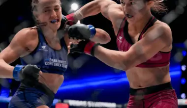 MMA fighters Itsuki Hirata and Jihin Radzuan touch gloves in the ring