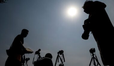 Photographers photographing the annular solar eclipse in Beijing on 21 June 2020. Photo by Noel Celis/AFP via Getty Images