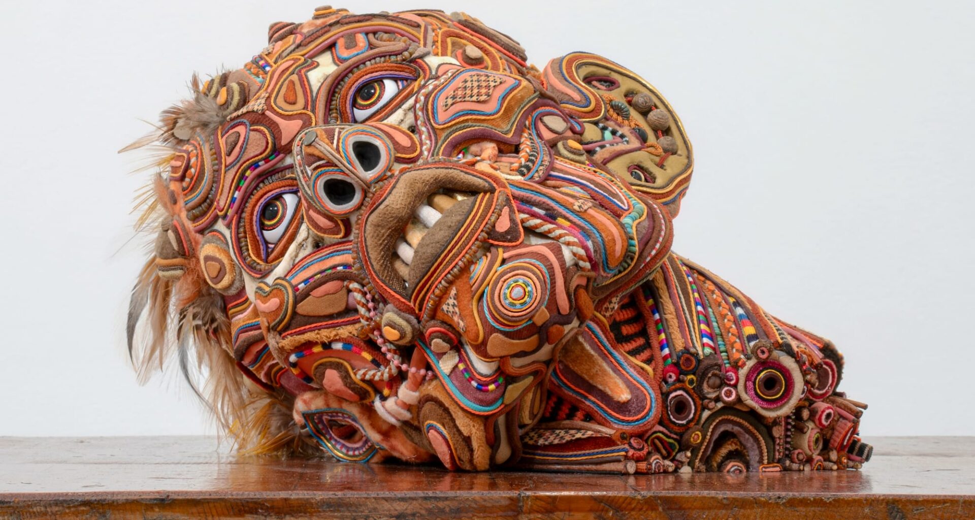 a sculpture by sungho bae of a mixed media head that appears like organs, tissues, and more