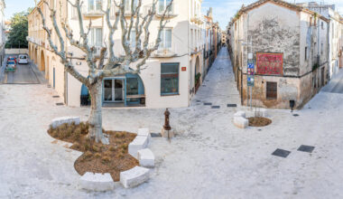 carved travertine transforms paving and planting across spanish town