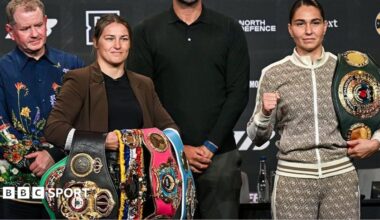 Katie Taylor holds the WBO, WBA and IBF light-welterweight titles and stands next to Flora Pili