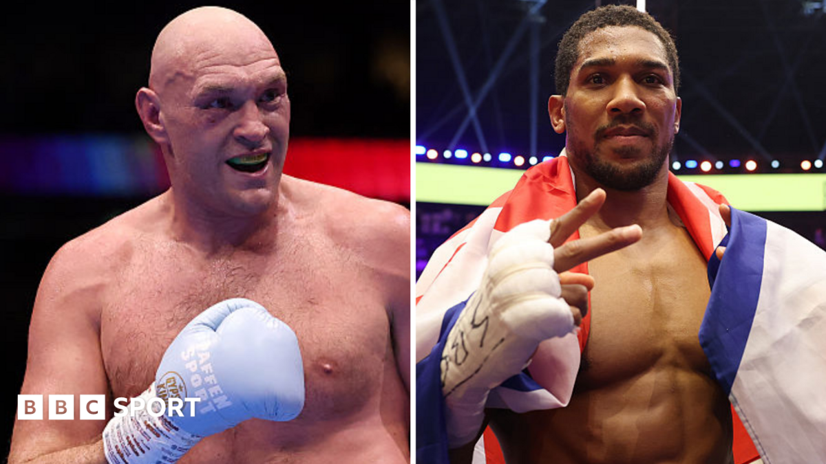 Tyson Fury holds up his hand and is wearing a boxing glove and Anthony Joshua holds up two fingers and has a Union Jack over his shoulders