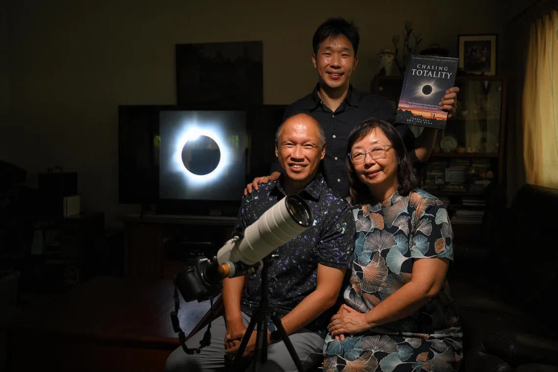 (Clockwise from bottom left) Koh Joo Beng, his wife Janet Tay and their son Jared with a photograph of a total solar eclipse with a “diamond ring” effect, which the elder Koh took in Western Australia in 2023. 