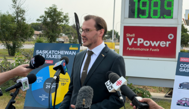 Gage Haubrich, prairie director with the Canadian Taxpayers Federation, speaks to reporters outside a Regina gas station on Tuesday, Aug. 11, 2026.