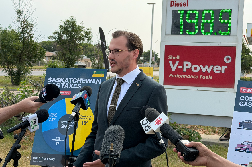 Gage Haubrich, prairie director with the Canadian Taxpayers Federation, speaks to reporters outside a Regina gas station on Tuesday, Aug. 11, 2026.