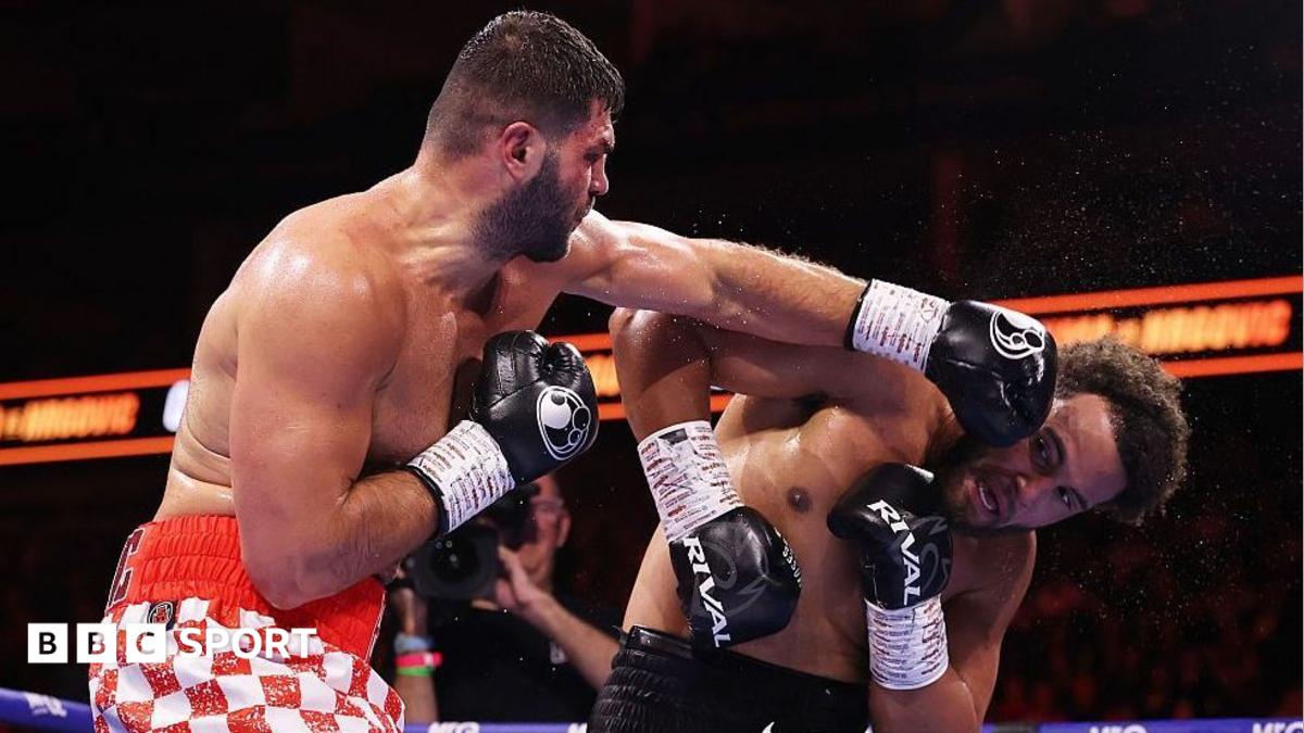 Filip Hrgovic has the IBF heavyweight title around his waist and holds up his fists