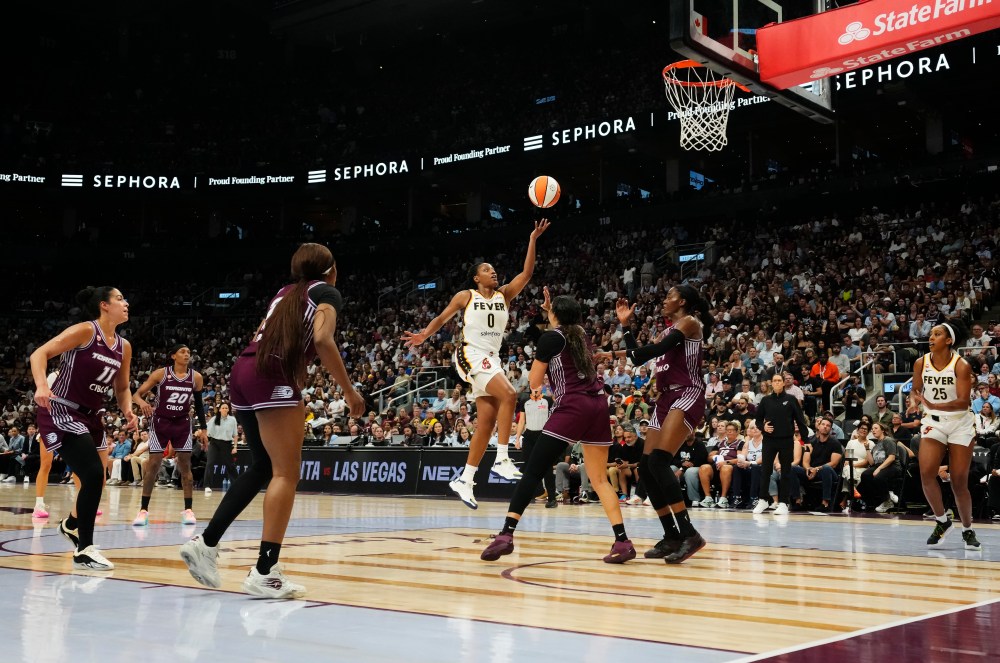 Indiana Fever's Kelsey Mitchell (0) scores past the Toronto Tempo defence during first half WNBA action in Toronto on Tuesday, Aug. 18, 2026. THE CANADIAN PRESS/Chris Young