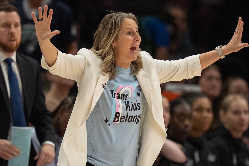 Cheryl Reeve motions on the sidelines while coaching.