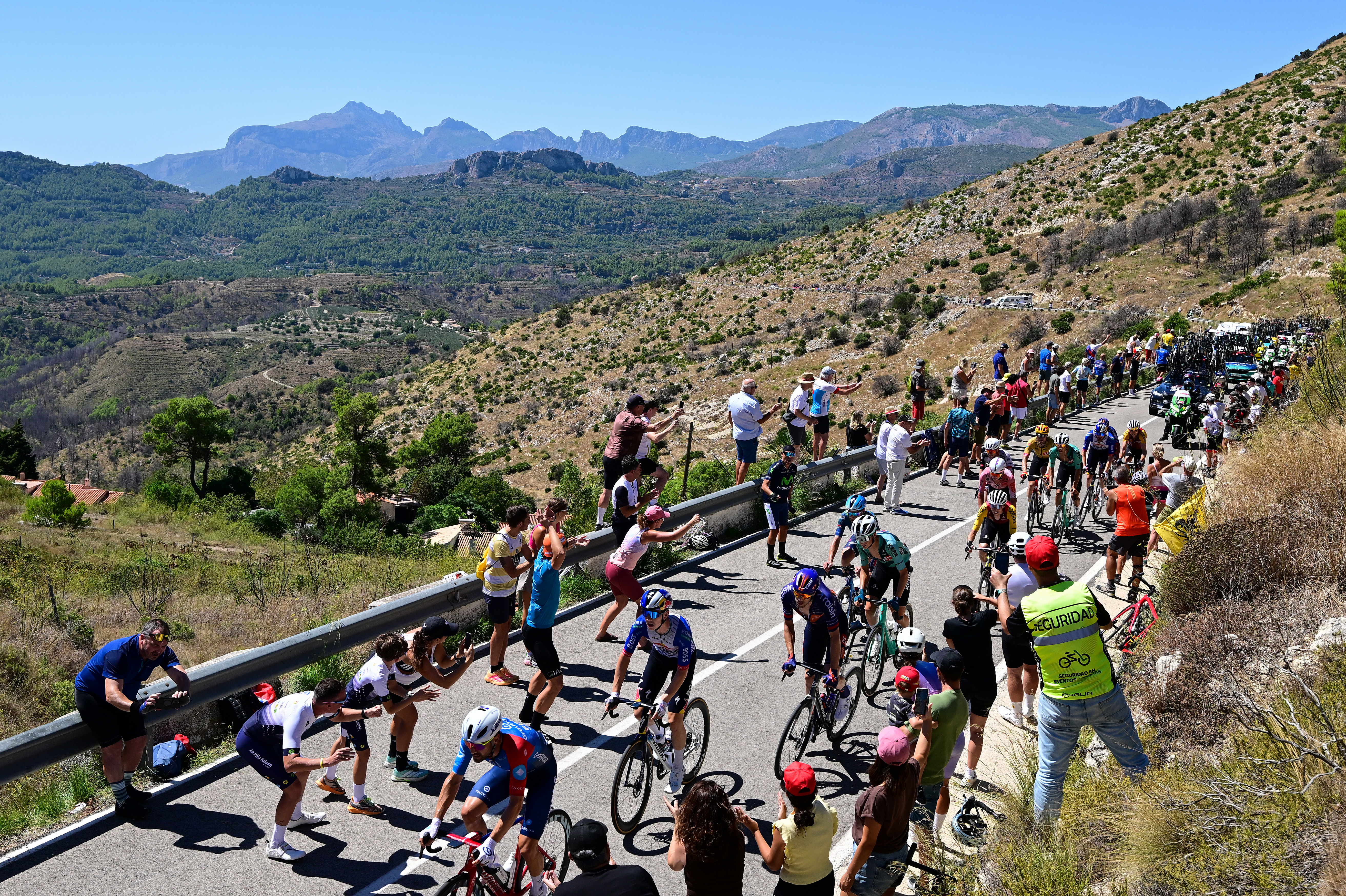 ALTO DE AITANA, SPAIN - AUGUST 30: A general view of the peloton passing the Coll de Rates (628m) during the La Vuelta - 81st Tour of Spain 2026, Stage 9 a 187.4km stage from Villajoyosa to Alto de Aitana 1544m / #UCIWT / on August 30, 2026 in Alto de Aitana, Spain. (Photo by Tim de Waele/Getty Images)
