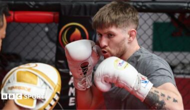 Jack Shore punches a pad in training