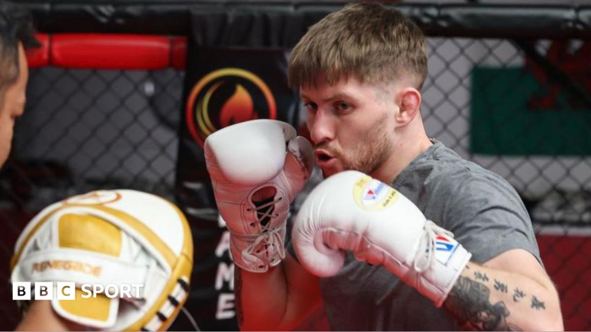 Jack Shore punches a pad in training