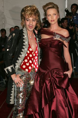 John Galliano and Charlize Theron at the 2006 Met Gala.Credit: Peter Kramer/Getty