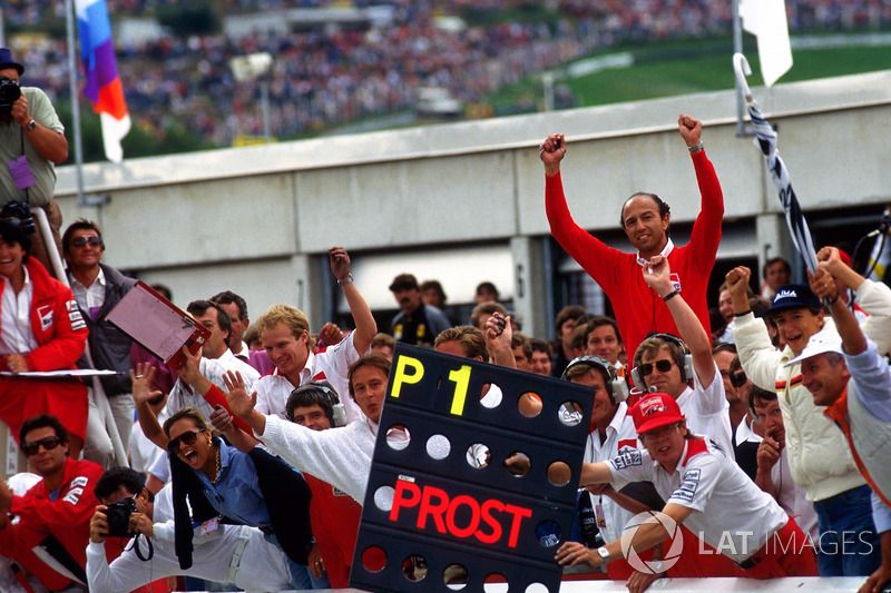 The McLaren crew celebrate Prost's 1985 title