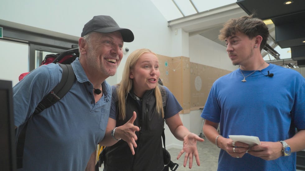 pictured: brian (left) and lucy (middle) conley with an associate (right). lucy and brian smile and gesture playfully to an associate off camera. pictured: brian (left) and lucy (middle) conley with an associate (right). lucy and brian smile and gesture playfully to an associate off camera.