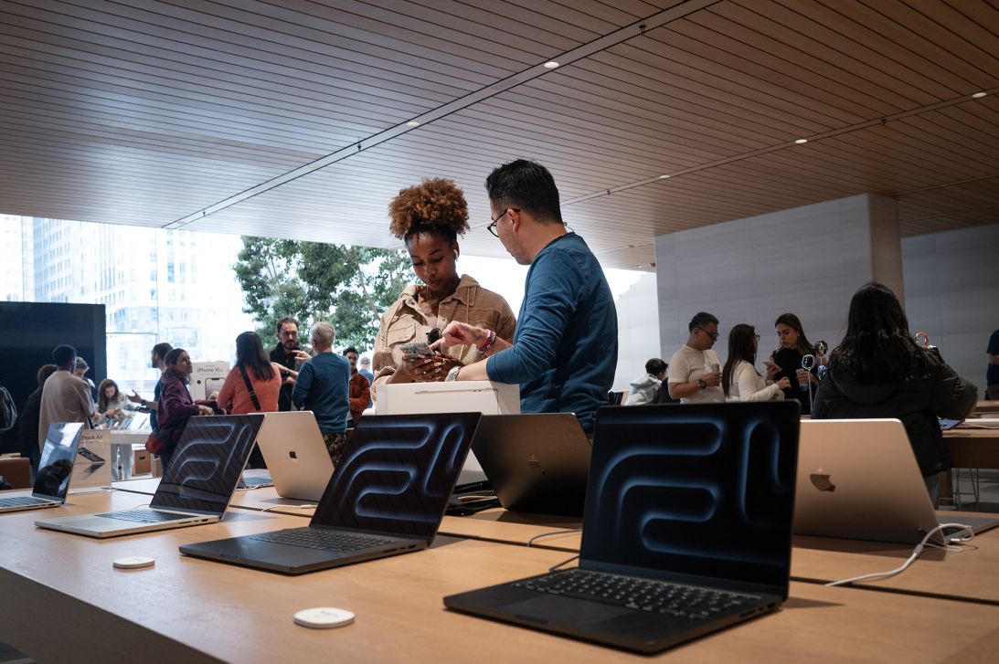 Customers shop electronics at an Apple store on April 14, 2025 in Chicago, Illinois.