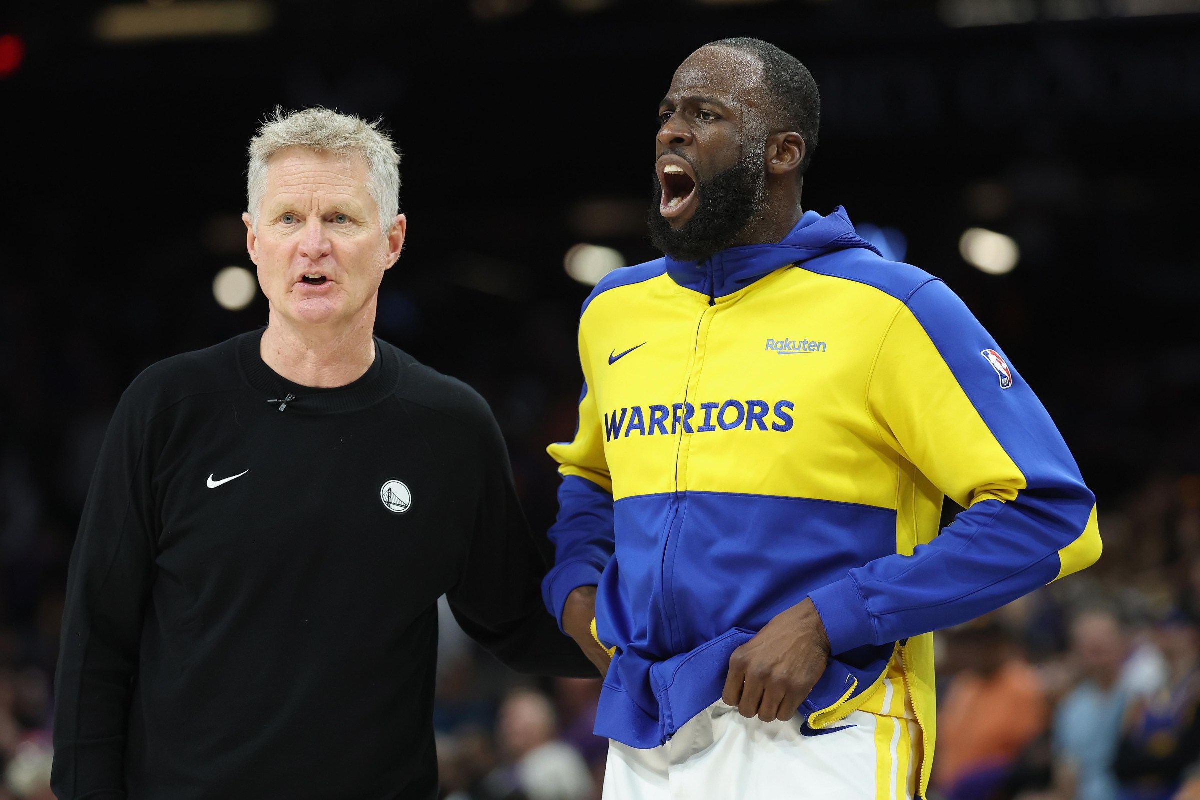 PHOENIX, ARIZONA - APRIL 17: Draymond Green #23 (R) of the Golden State Warriors reacts alongside head coach Steve Kerr after being ejected during the final moments of an NBA play-in tournament game against the Phoenix Suns at Mortgage Matchup Center on April 17, 2026 in Phoenix, Arizona. The Suns defeated the Warriors 111-96. NOTE TO USER: User expressly acknowledges and agrees that, by downloading and or using this photograph, user is consenting to the terms and conditions of the Getty Images License Agreement. (Photo by Christian Petersen/Getty Images)