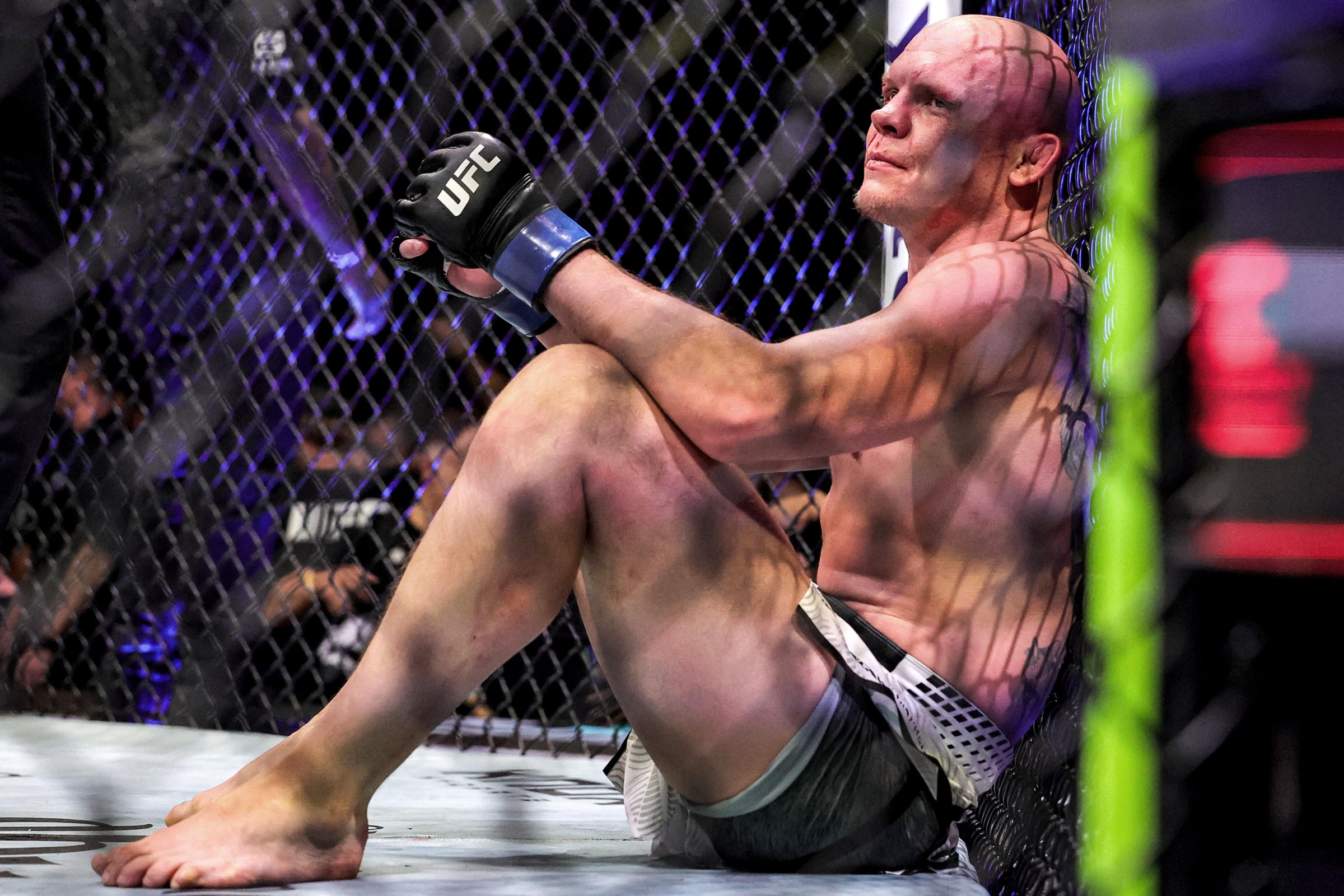 Uzbekistan’s Bogdan Guskov reacts during his men’s light heavyweight fight against Russia’s Magomed Ankalaev in the UFC Fight Night event at Etihad Arena in Abu Dhabi on July 25, 2026. (Photo by Fadel SENNA / AFP via Getty Images)