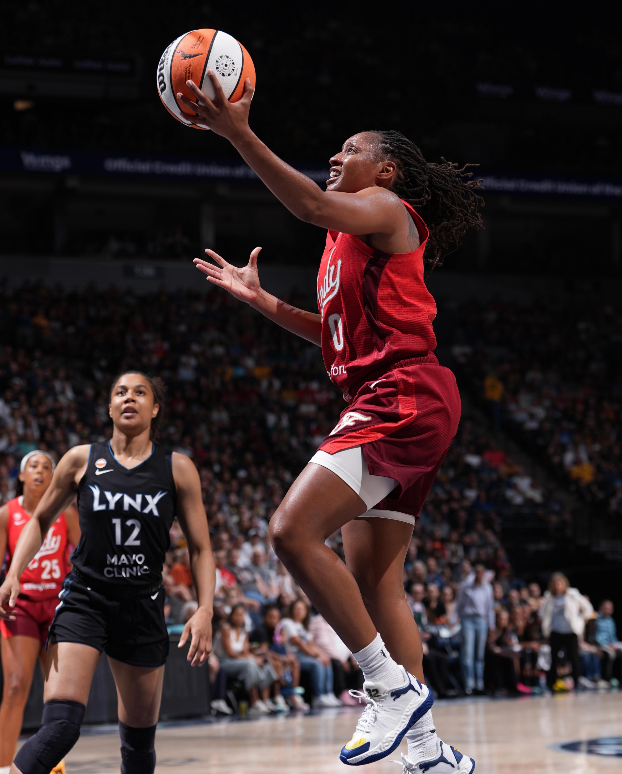 Kelsey Mitchell soars for a layup vs. the Lynx.