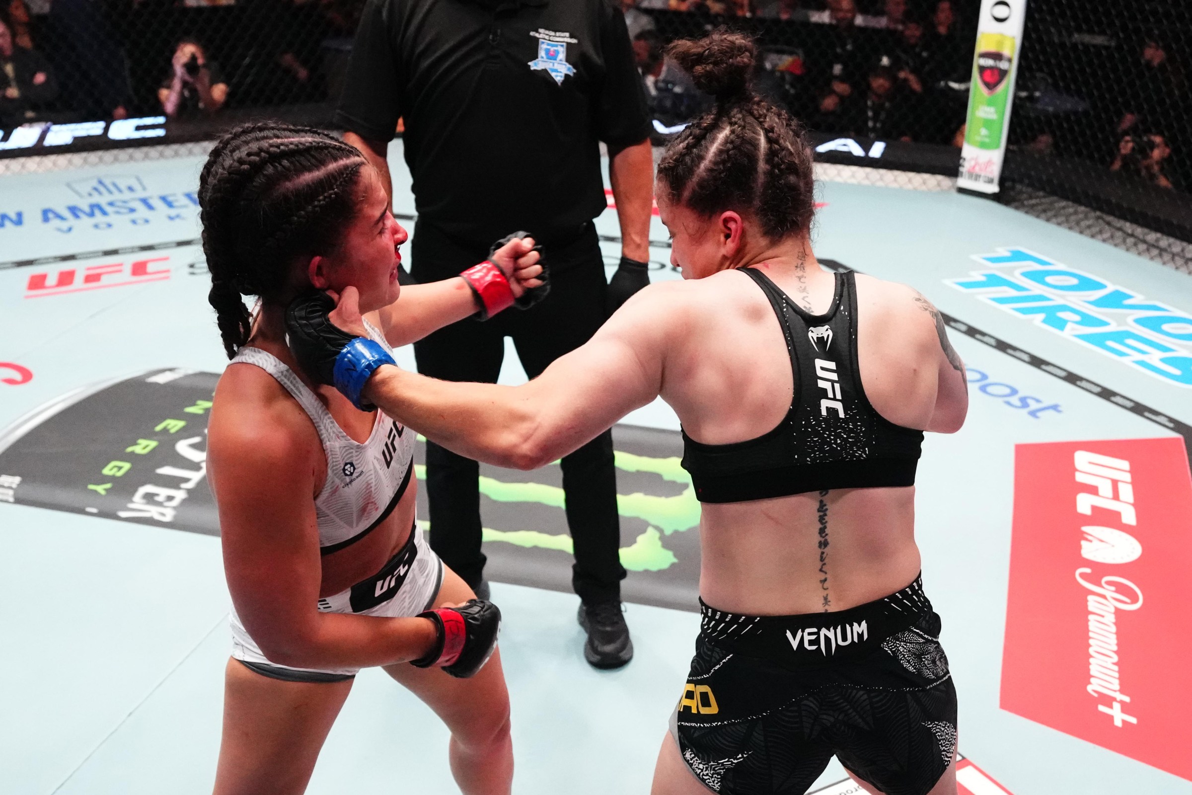 LAS VEGAS, NEVADA - AUGUST 08: Carol Foro of Brazil punches Gigi Canuto of Brazil in a strawweight fight during the UFC Fight Night event at Meta APEX on August 08, 2026 in Las Vegas, Nevada. (Photo by Jeff Bottari/Zuffa LLC)