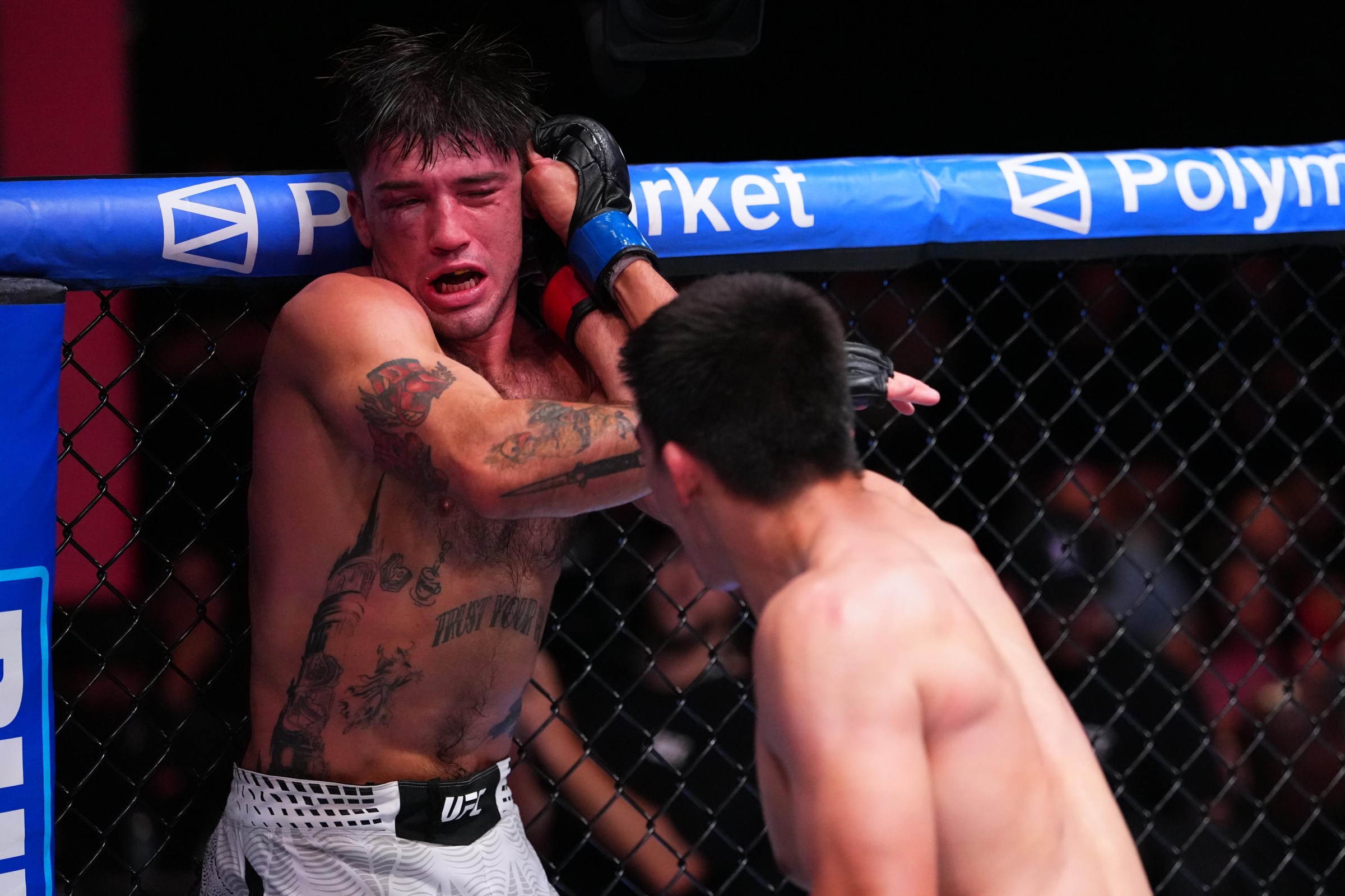 LAS VEGAS, NEVADA - AUGUST 08: (R-L) Ty Miller punches Billy Ray Goff in a welterweight fight during the UFC Fight Night event at Meta APEX on August 08, 2026 in Las Vegas, Nevada. (Photo by Jeff Bottari/Zuffa LLC)