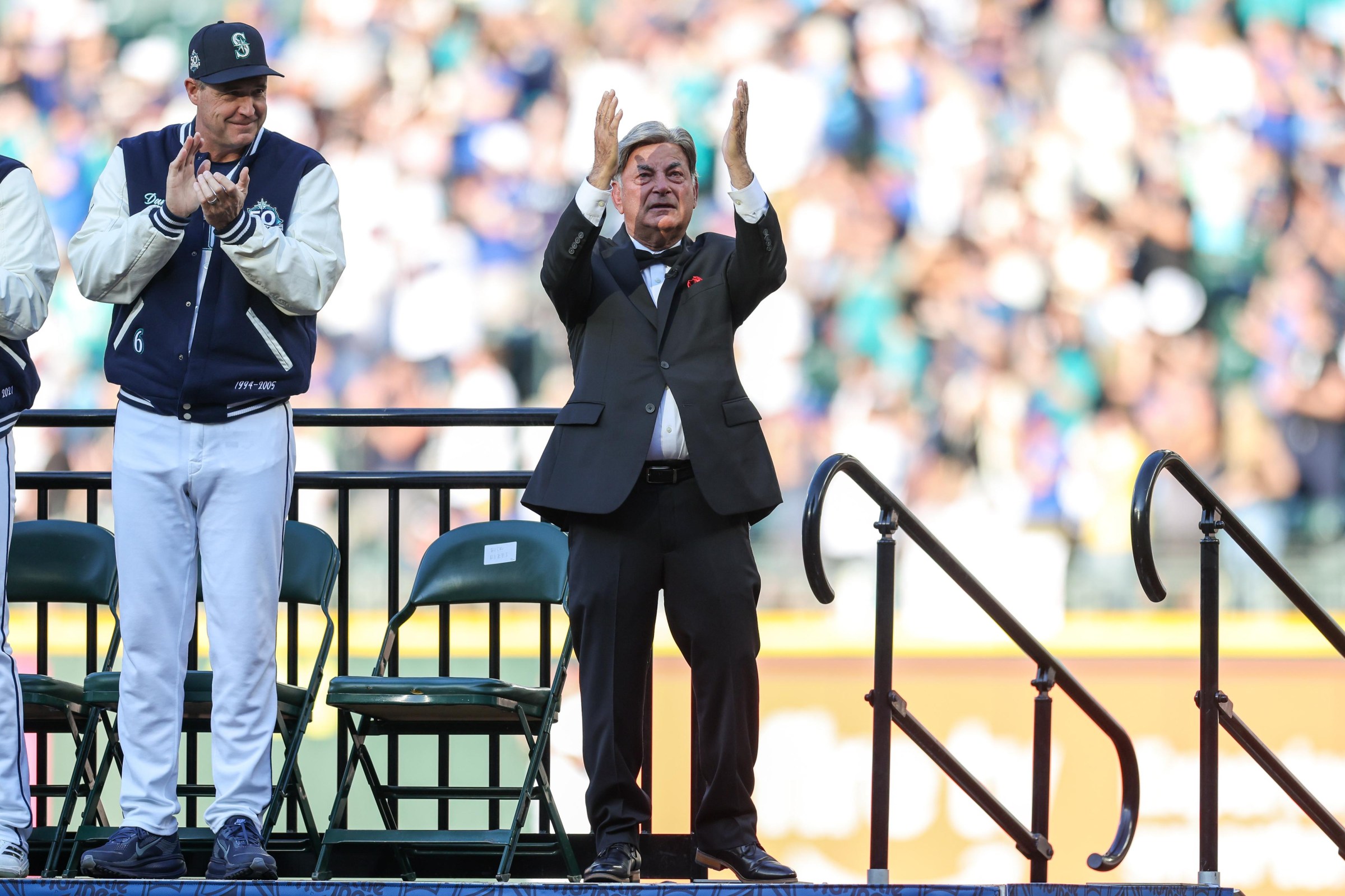 SEATTLE, WASHINGTON - AUGUST 08: The Voice of the Seattle Mariners Rick Rizzs reacts to a standing ovation during the Seattle Mariners 50th Season Celebration at T-Mobile Park on August 08, 2026 in Seattle, Washington. (Photo by Jack Compton/Getty Images)