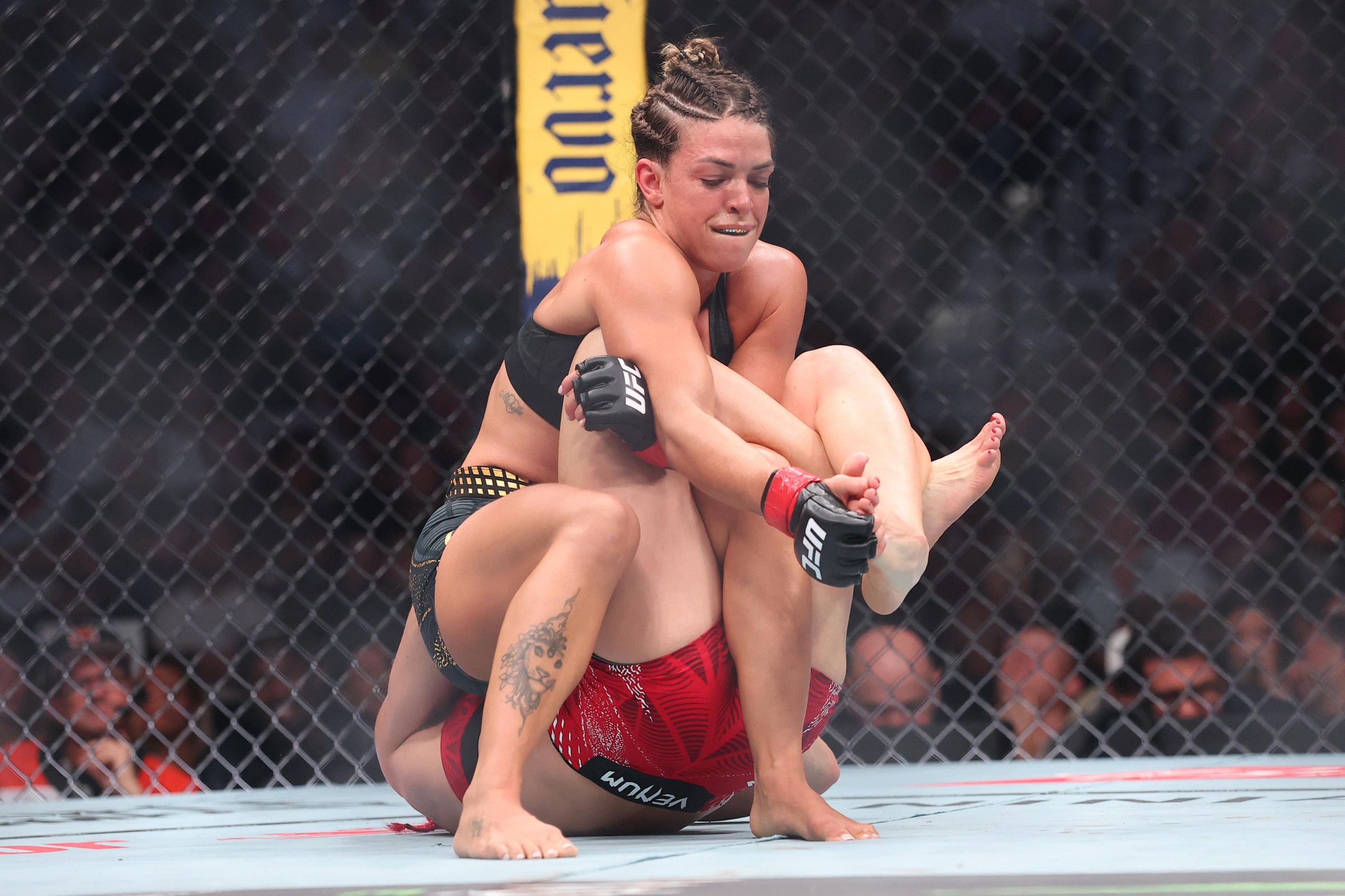PHILADELPHIA, PENNSYLVANIA - AUGUST 15: (L-R) Mackenzie Dern grapples Gillian Robertson of Canada in the UFC strawweight championship fight during the UFC 330 event at Xfinity Mobile Arena on August 15, 2026 in Philadelphia, Pennsylvania. (Photo by Ed Mulholland/Zuffa LLC)