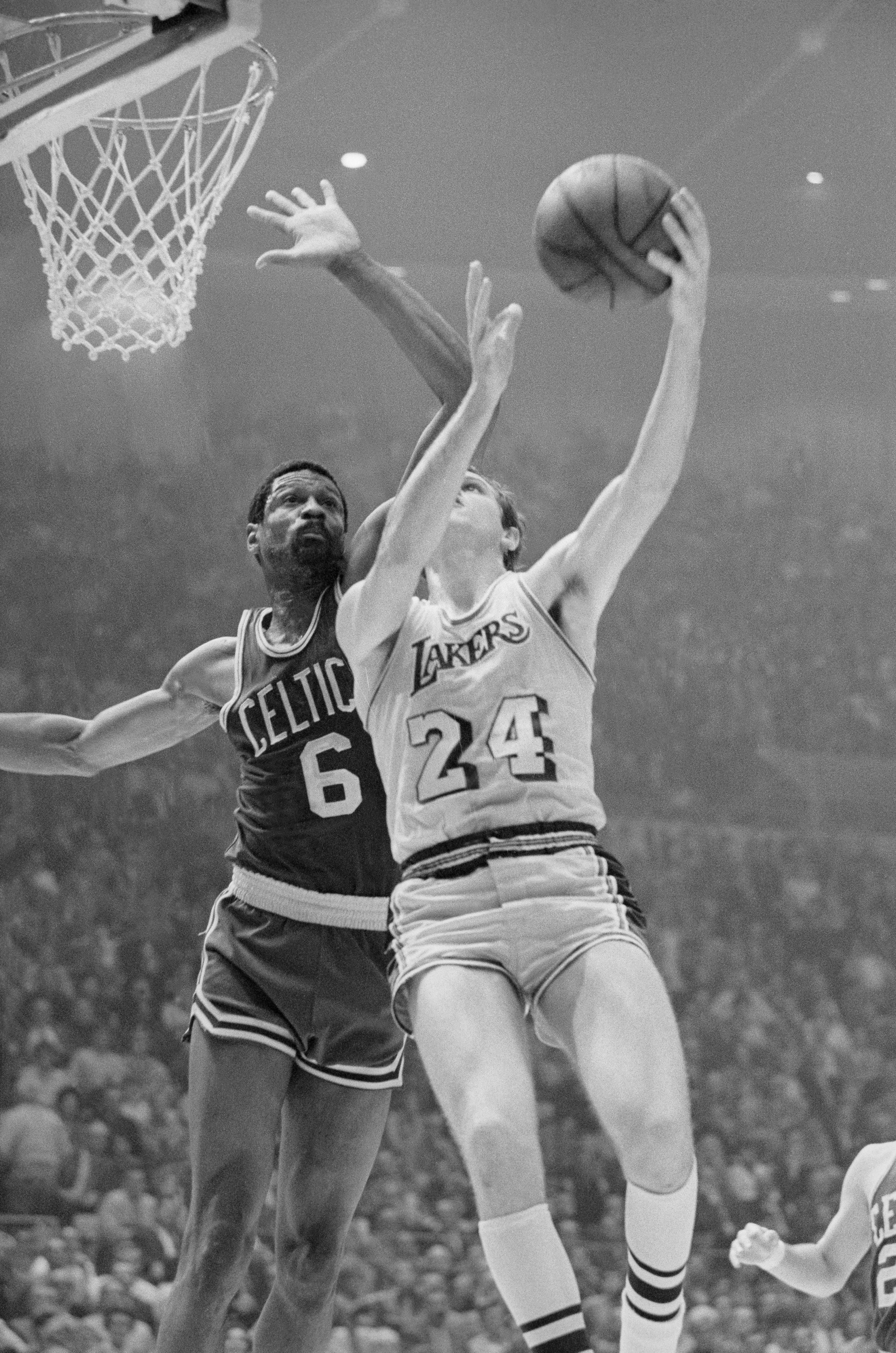 Boston’s player-coach Bill Russell blocks a shot by Keith Erickson as the Celtics defeat the Lakers, 108-106, in Game 7 of the 1969 NBA Finals.