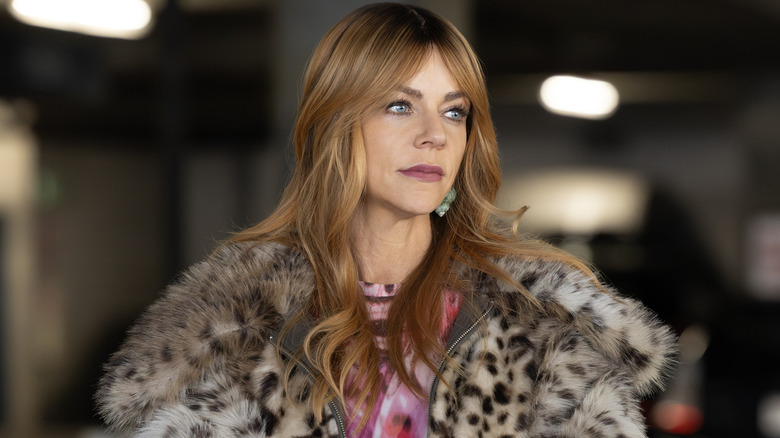 Morgan Gillroy in a leopard print fur jacket in 