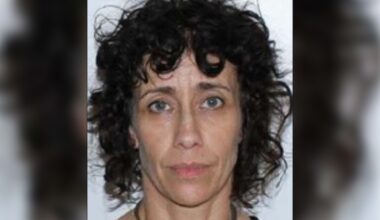 Mugshot of a woman with black hair.