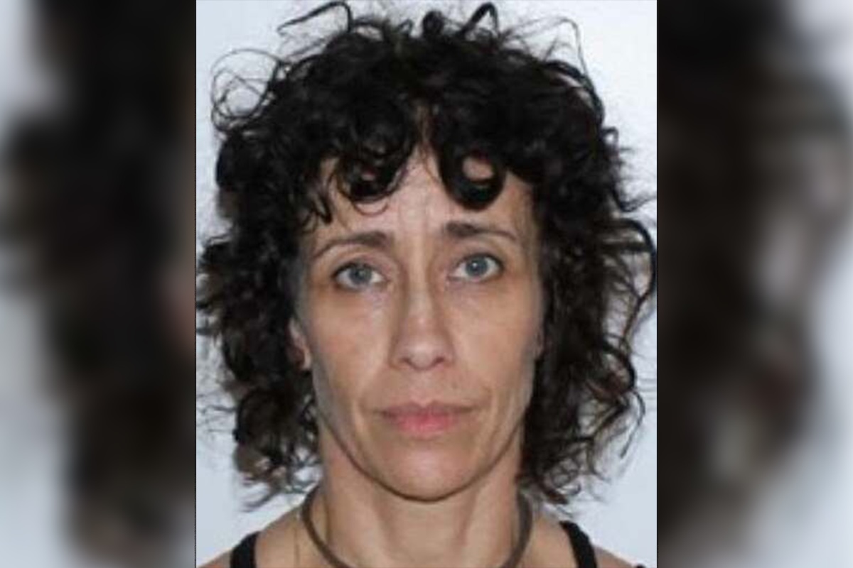Mugshot of a woman with black hair.