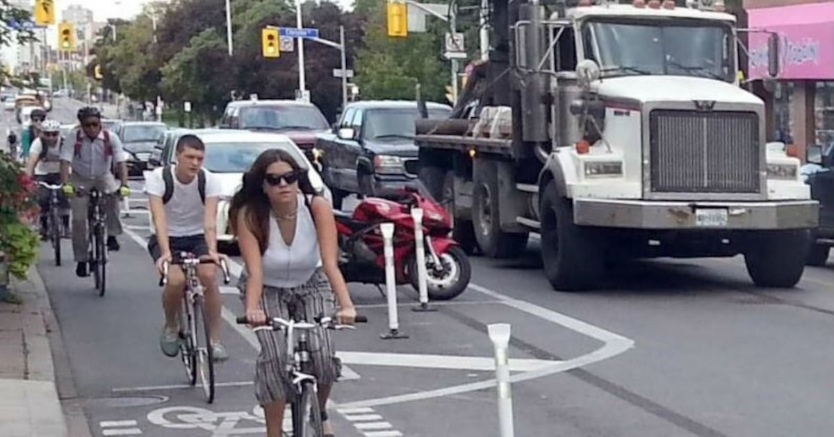 Cyclists bike in protest against Toronto bike lane removal – CP24