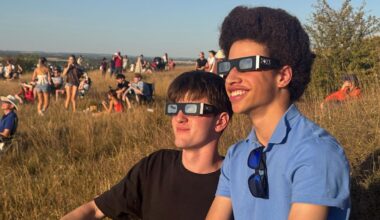 Hundreds gather to watch eclipse on hillside